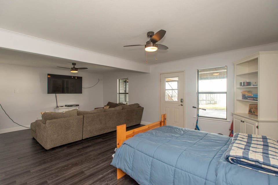 Another view of the downstairs living area with big screen television.
