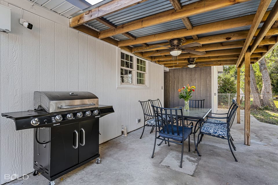 Fire up the grill and relax on the patio chairs and table in the back yard!