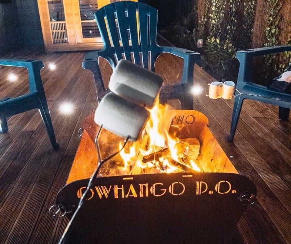 Toasting marshmallows to make S'mores