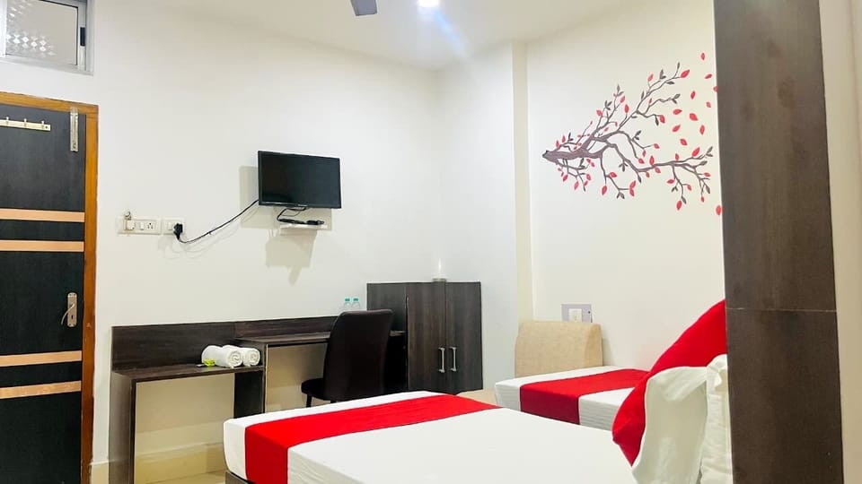 Corporate Twin Ac | Living area | 14-inch LED TV with satellite channels, TV, fireplace