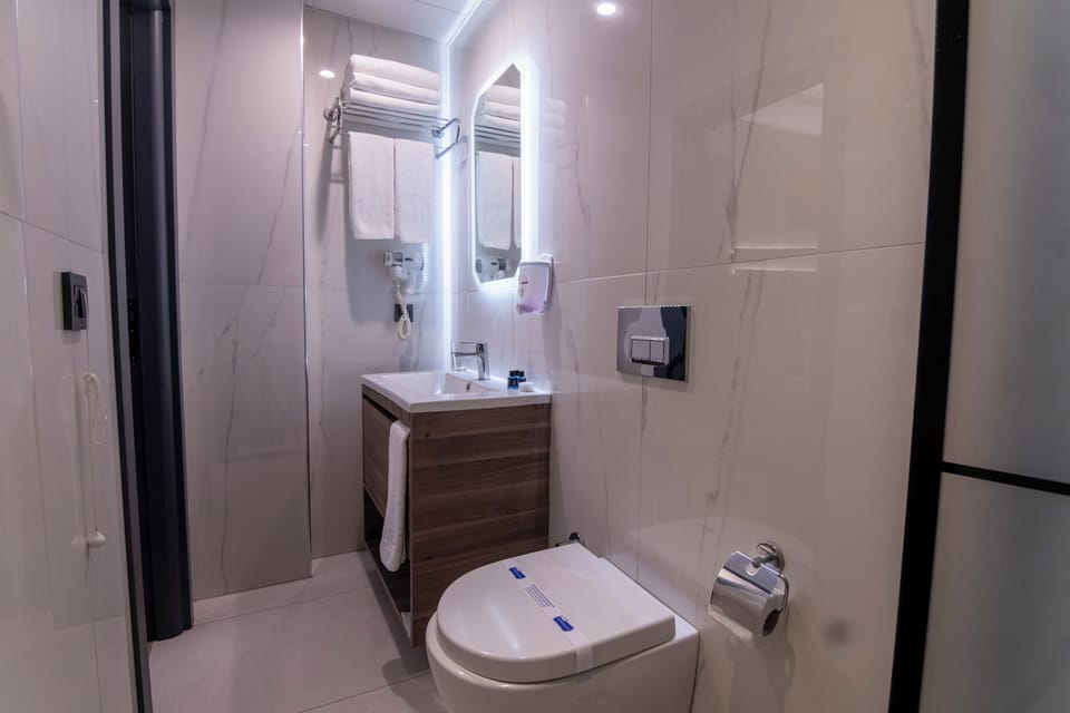 Shower, free toiletries, hair dryer, slippers