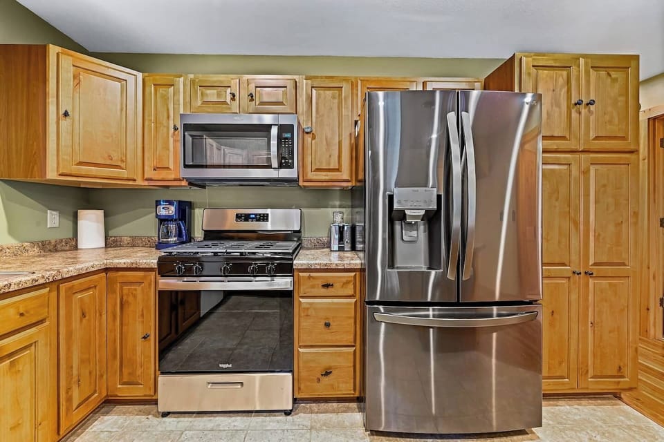 The kitchen is stocked with newer gas-burning stove, microwave and large fridge.  A dishwasher makes clean up a breeze because it is vacation and who wants to do dishes!