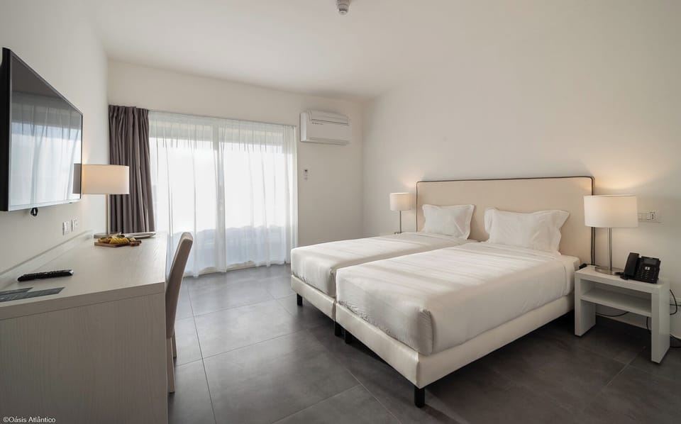 Deluxe Double Room | Minibar, in-room safe, desk, blackout drapes