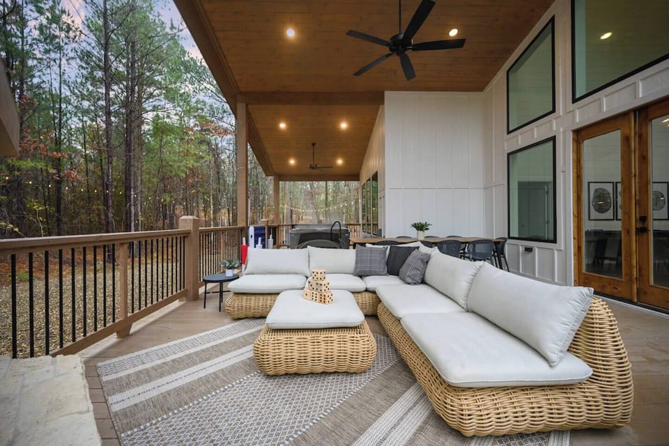 Enjoy the back deck with private hot tub, grill, custom swings and part lit backyard with fire pit. 