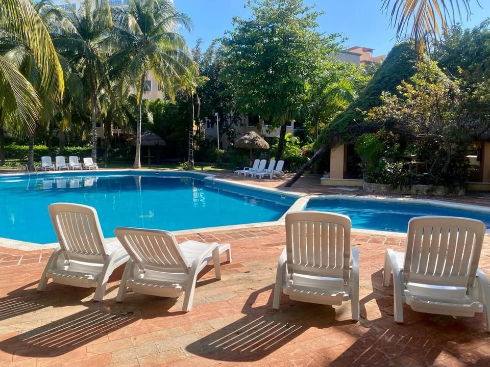 Unwind in the shade or soak up the sun at this poolside spot.