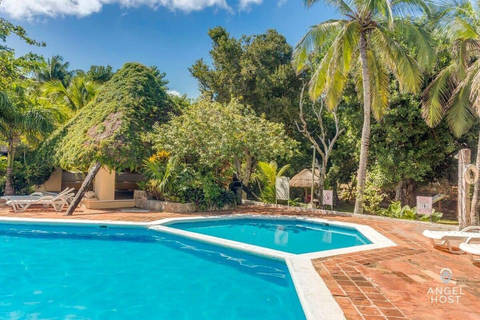 Take a refreshing dip surrounded by lush greenery and tropical charm.