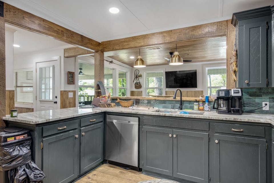 Kitchen looking into living with lake view.