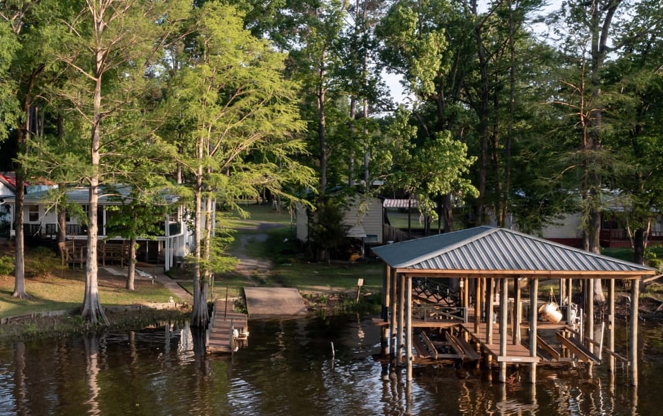 Boathouse, lanch, floating pier, and house.