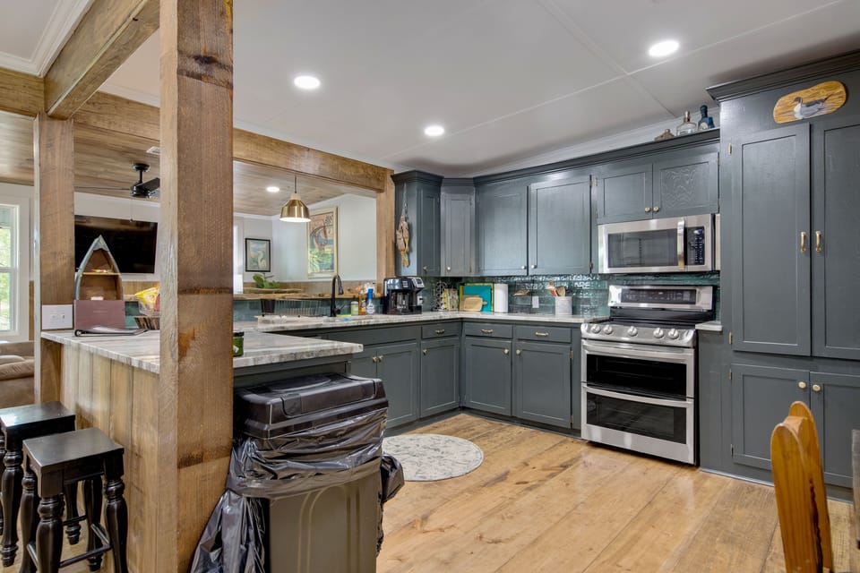 Double oven with stove top and microwave above.