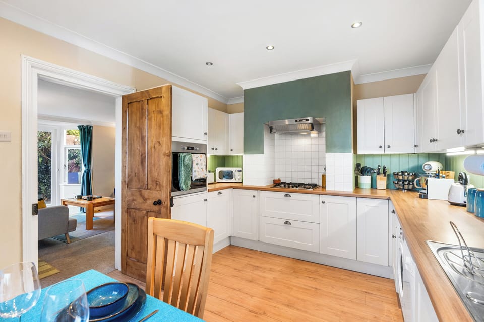 Fully equipped kitchen with oven, hob, and cookware provided