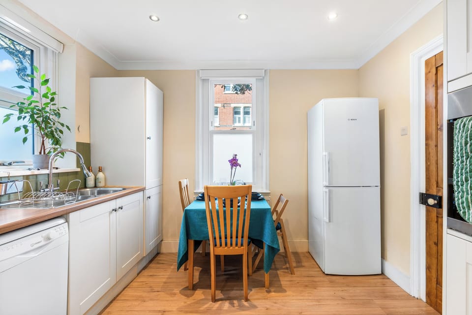 Spacious kitchen with large fridge-freezer and good cupboard space