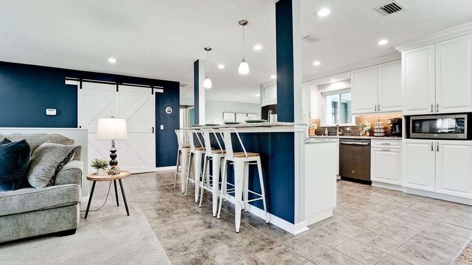 The breakfast bar comfortably seats 4, making it an ideal spot for kids to eat.