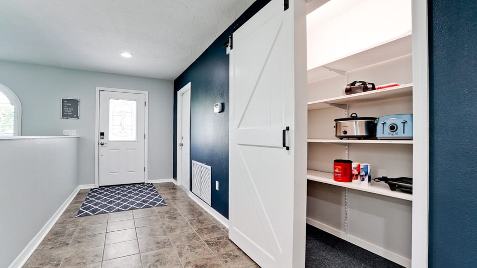 Fully stocked pantry with appliances. Toaster, crockpot, griddle, blender, iron.