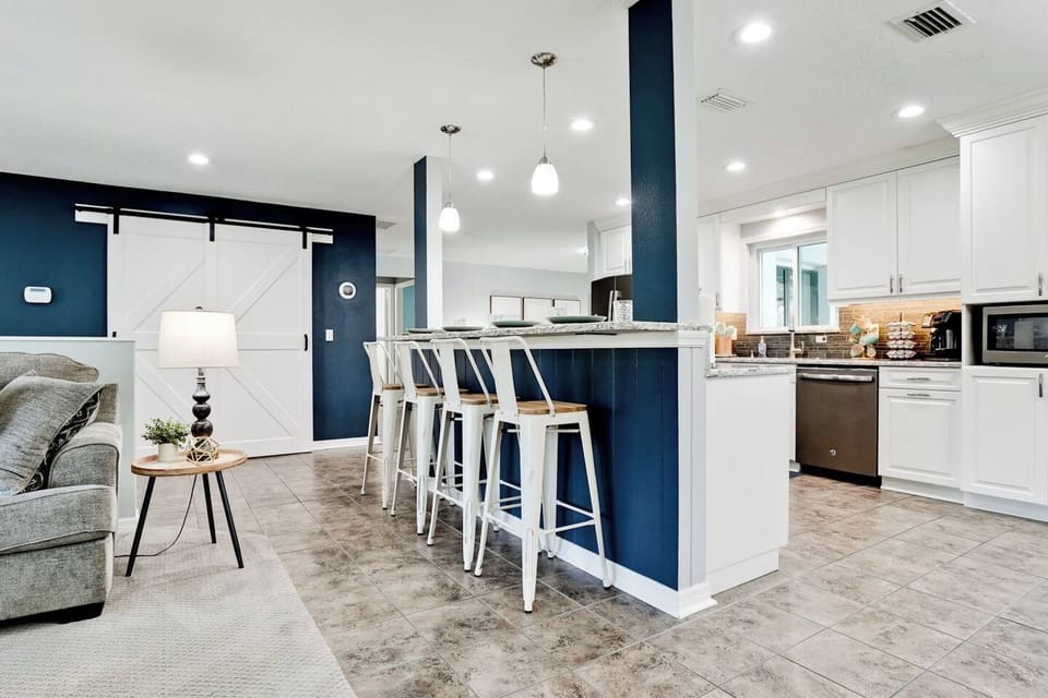 The breakfast bar comfortably seats four, making it an ideal spot for kids to savor their meals.
