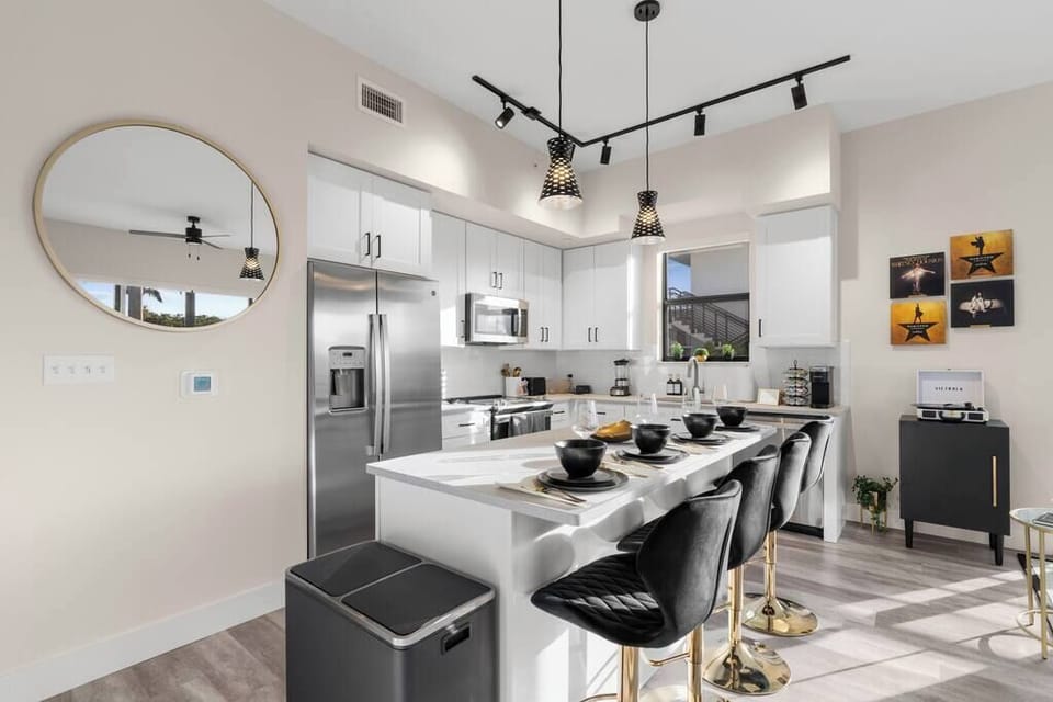 [Kitchen] - stainless steel appliances, large island w/ four person seating