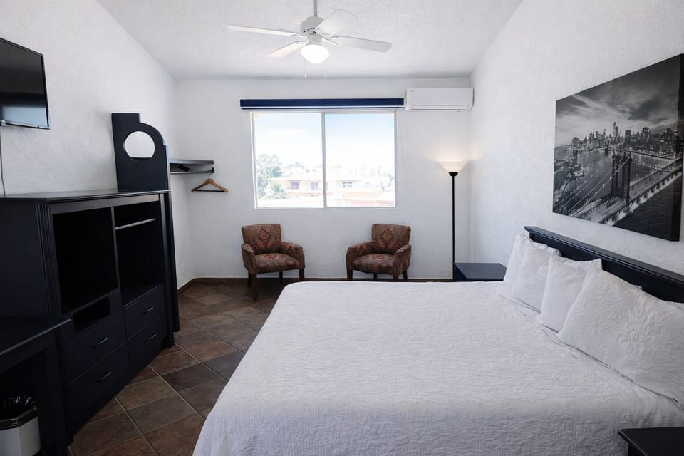 Standard Room, 1 King Bed | Down comforters, iron/ironing board (on request), bed sheets