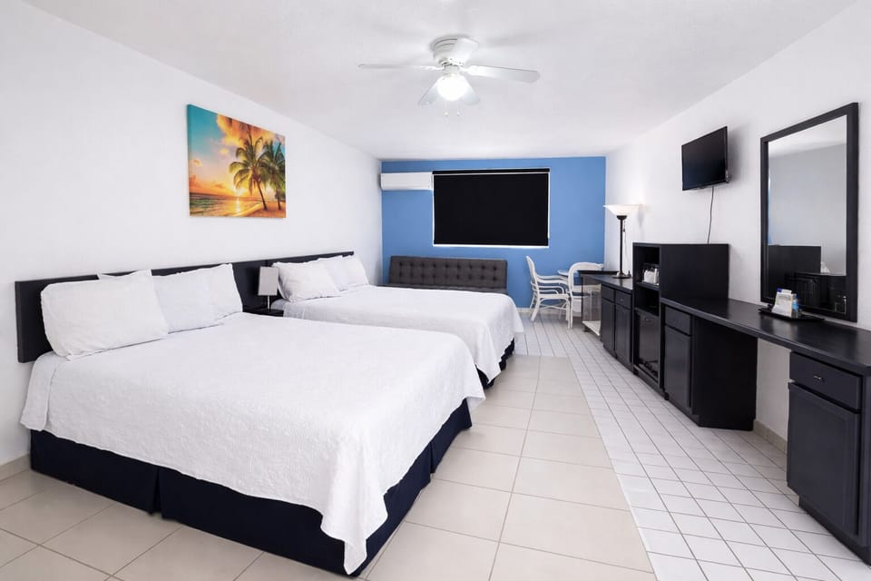 Deluxe Studio Suite, 2 Queen Beds | Down comforters, iron/ironing board, bed sheets