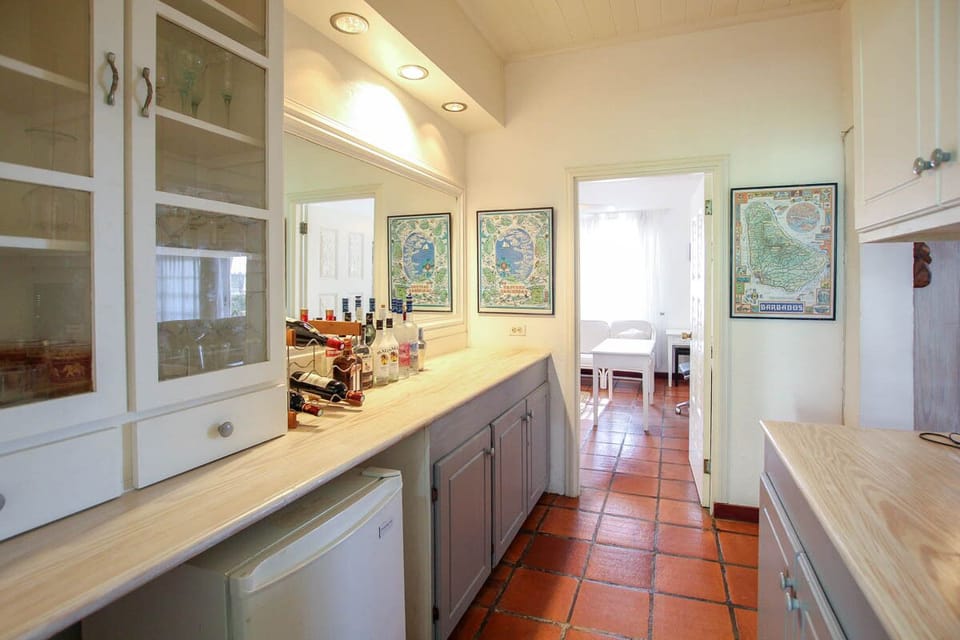 Bar area with mini fridge attached to the kitchen
