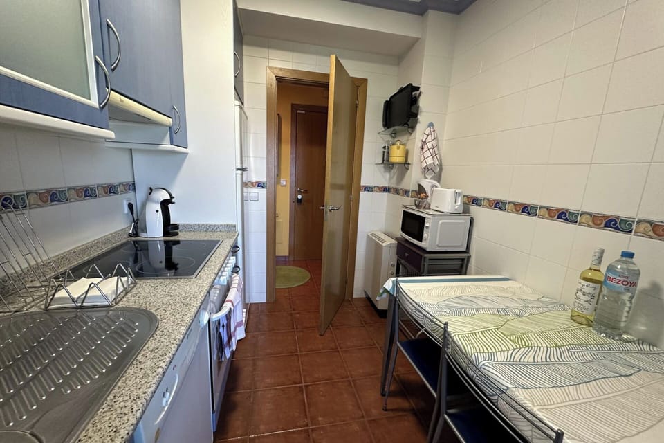 Fully equipped kitchen with dishwasher, oven, microwave, ceramic cooktop, coffee machine, refrigerator, etc.