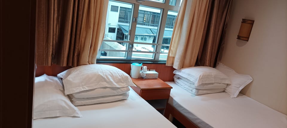 Standard Quadruple Room | Blackout drapes, iron/ironing board, free WiFi, bed sheets