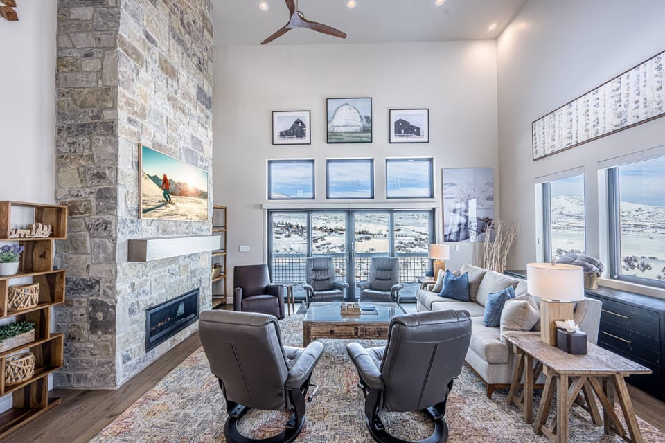 Featuring a large natural rock fireplace, 65" Samsung The Frame Smart TV and comfortable furnishings. It's the perfect place to gather and enjoy a mov