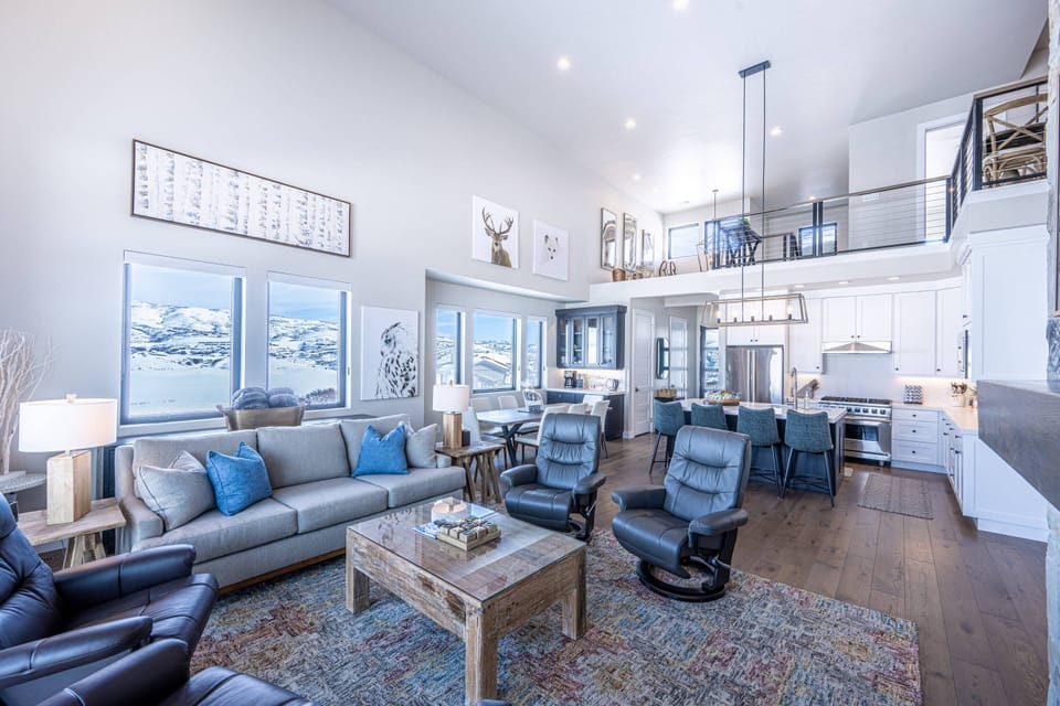 Open-concept living space designed for large group stays in Park City near Deer Valley. Mountain and Jordanelle Lake Views