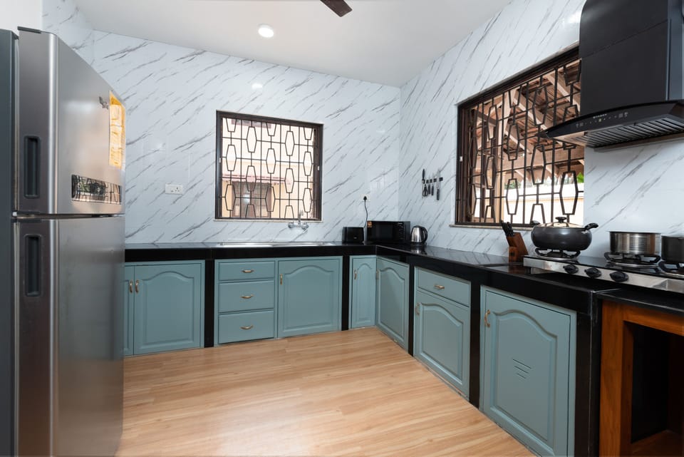 Grand Villa | Private kitchen | Full-size fridge, electric kettle, highchair