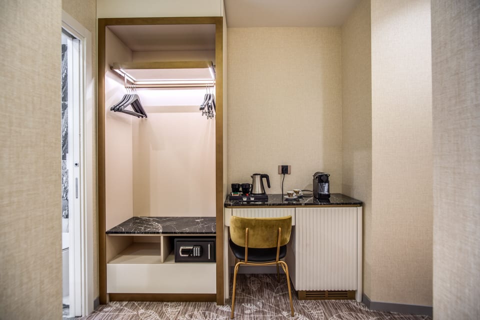 Premium Triple Room | Minibar, in-room safe, desk, blackout drapes