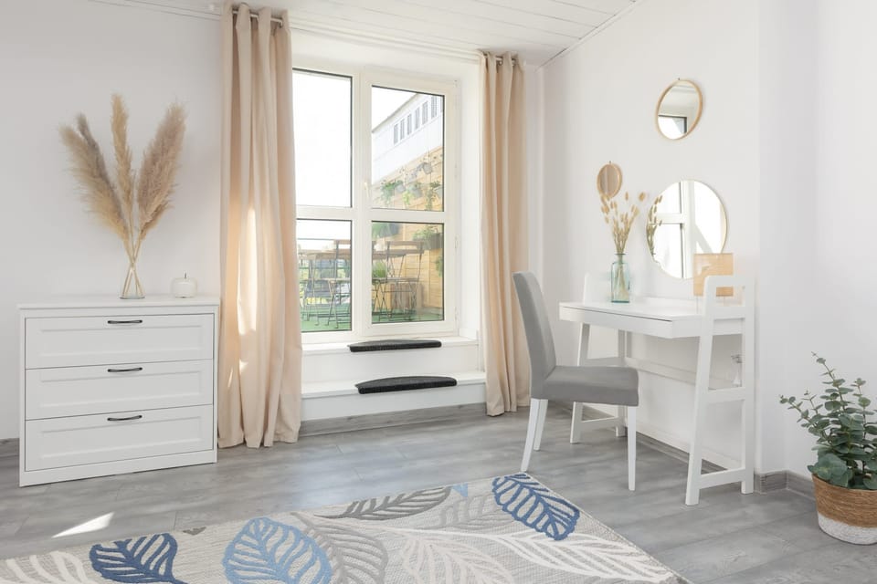 Another perspective of a bedroom with a desk and chair, ideal for remote working.