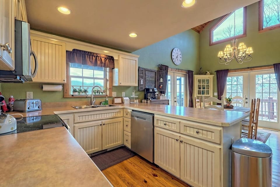 Cute country kitchen with lots of countertop space and light from all angles!