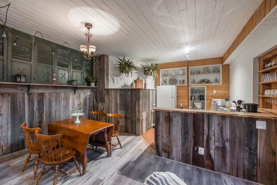 Fully-stocked kitchen with a fridge, stove/oven and microwave