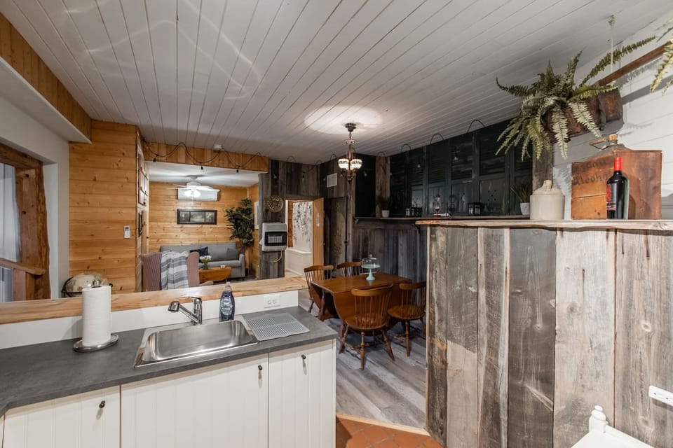 Fully-stocked kitchen with a fridge, stove/oven and microwave