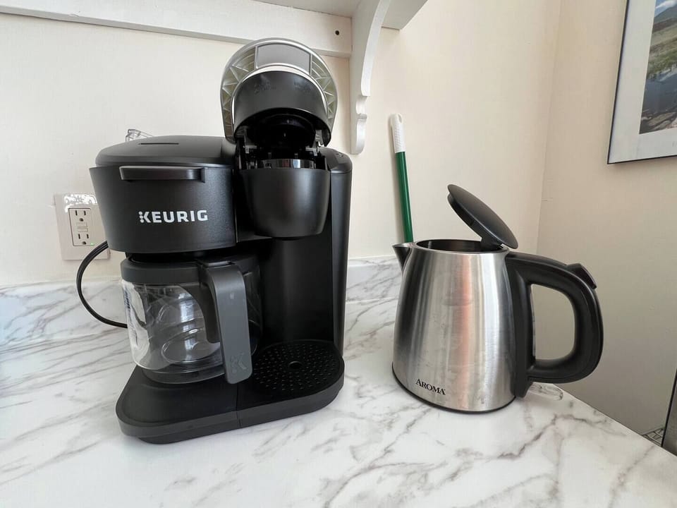 Keurig coffee maker - single cup or full pot.  Hot water kettle for the tea drinkers.