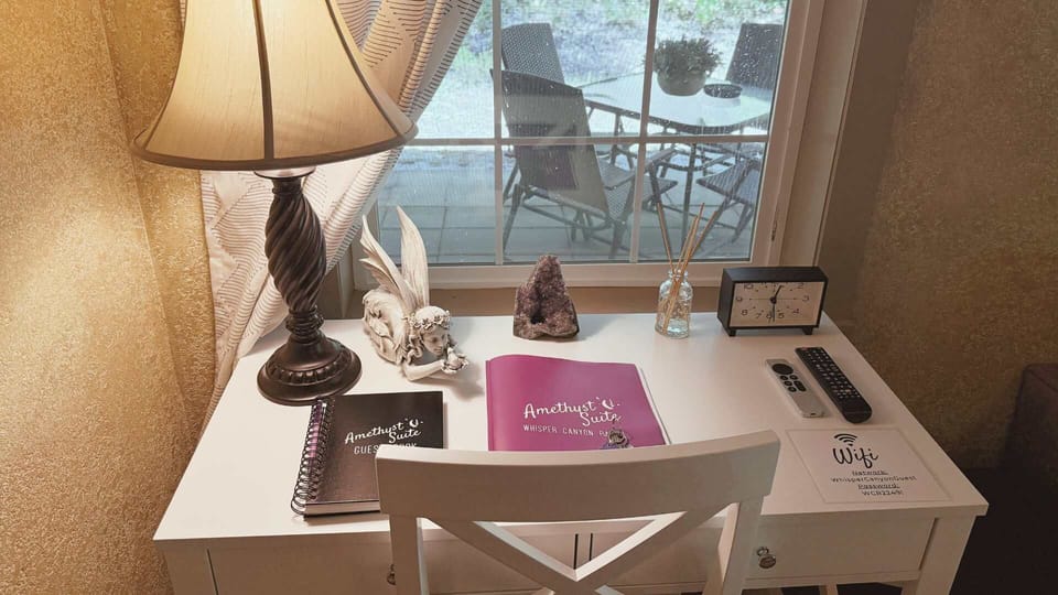 Desk with crystal décor and garden-view window.