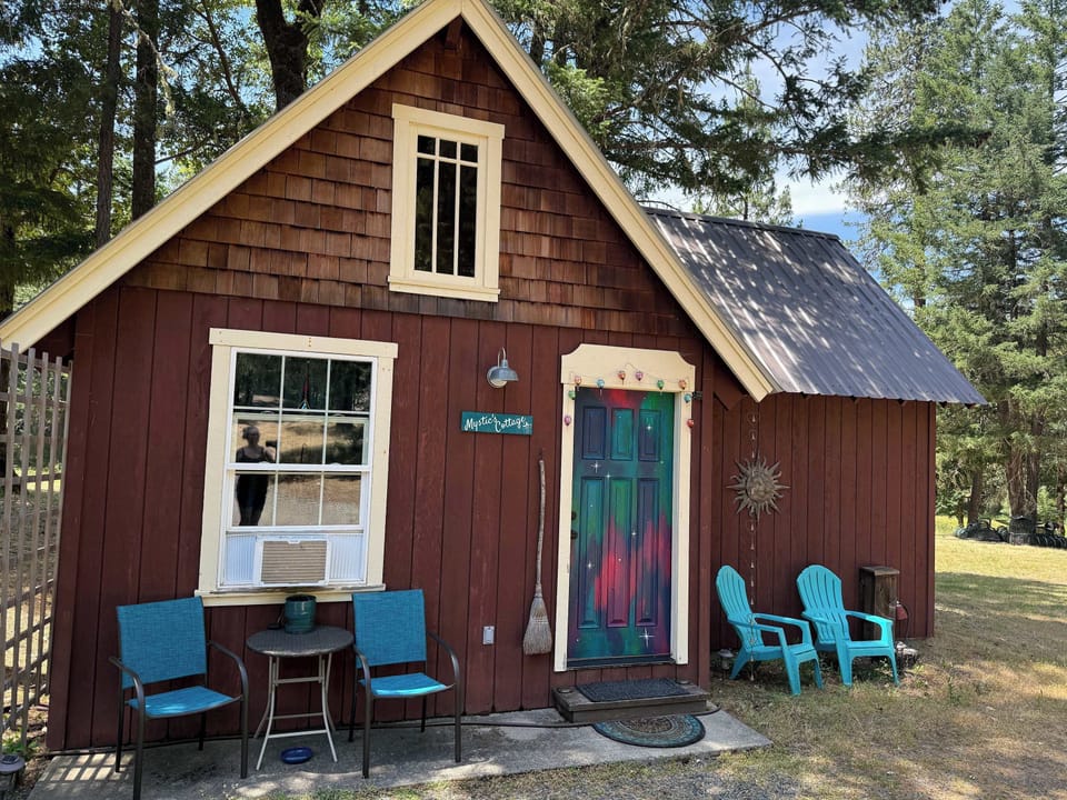 Unwind outside of the Mystic's Cottage tucked in the forest.