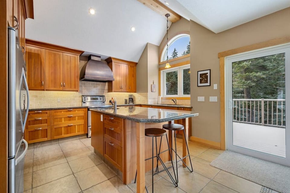 A full chef`s kitchen with access to the private balcony/deck.