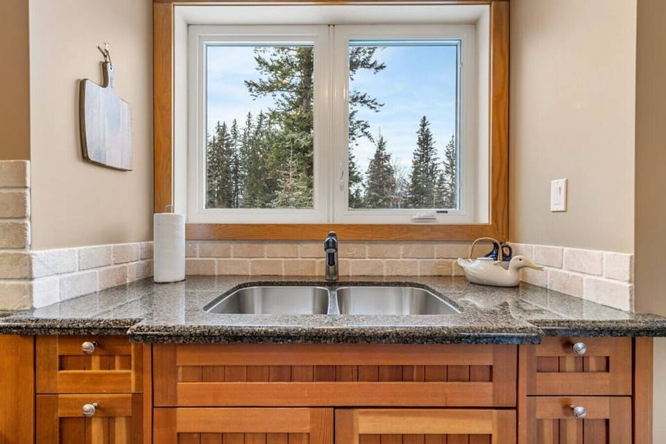 A full chef`s kitchen with access to the private balcony/deck.