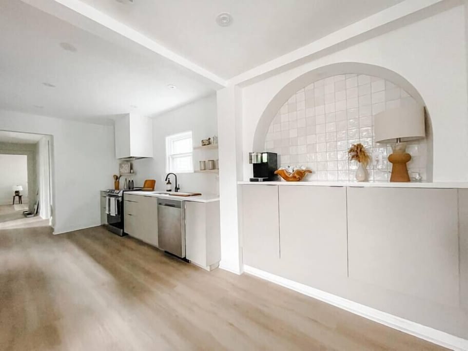 View of the kitchen and coffee bar from the living room. 