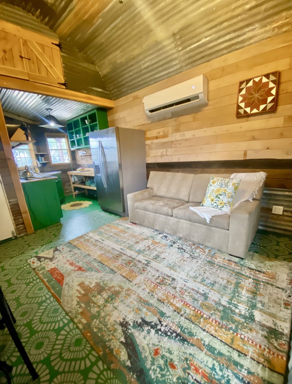 Cozy living area with full sofa sleeper, SMART TV, and blackout shades.