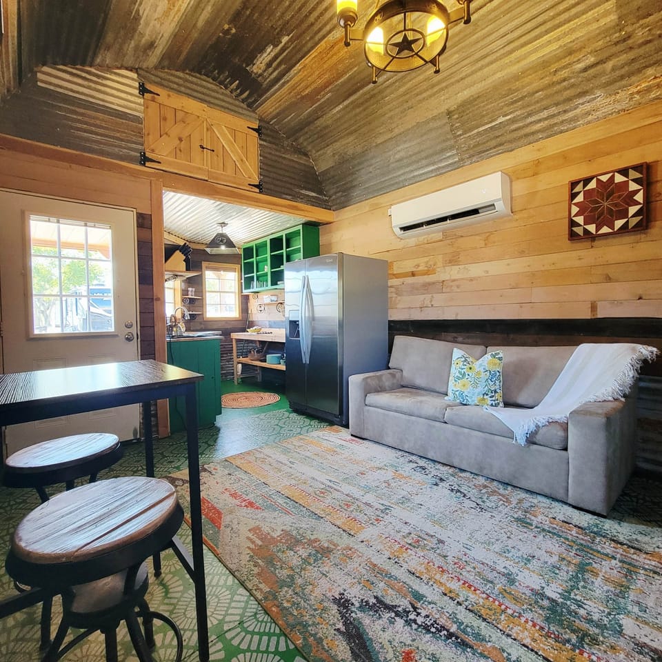 Cozy living area with full sofa sleeper, SMART TV, and blackout shades.