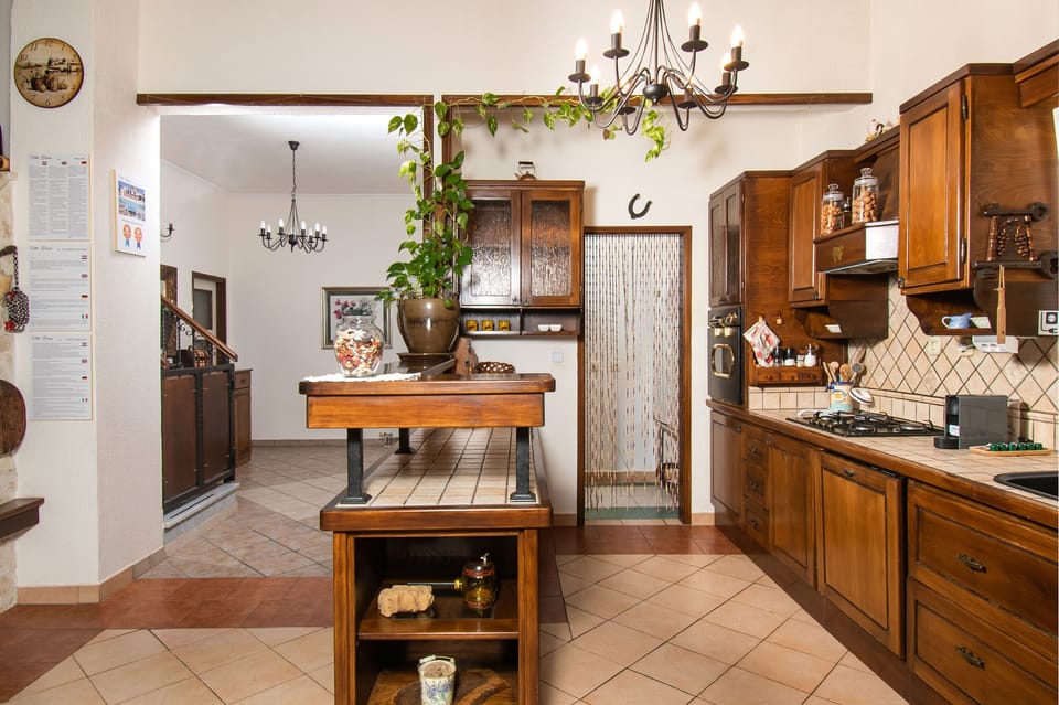 Villa | Private kitchen | Fridge, microwave, oven, stovetop