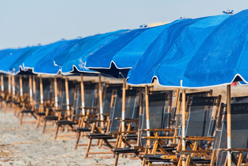 You can rent an umbrella setup from the lifeguards during peak season