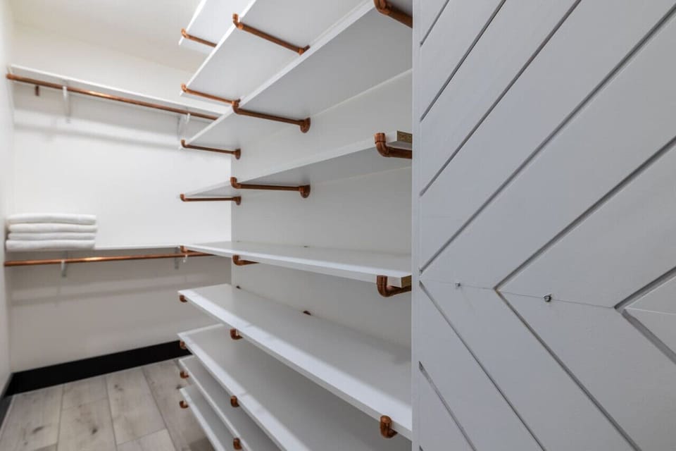 Walk-in Closet: Ample space for your wardrobe and vacation essentials, conveniently organized!