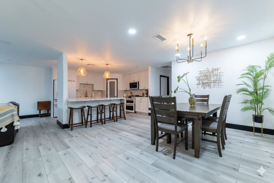Dining Area: Bright, contemporary space for family dinners and game nights under stylish lighting!