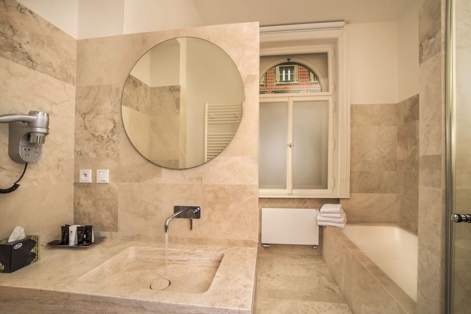 Luxury Double Room, 1 Bedroom, Corner | Bathroom | Designer toiletries, hair dryer, slippers, towels