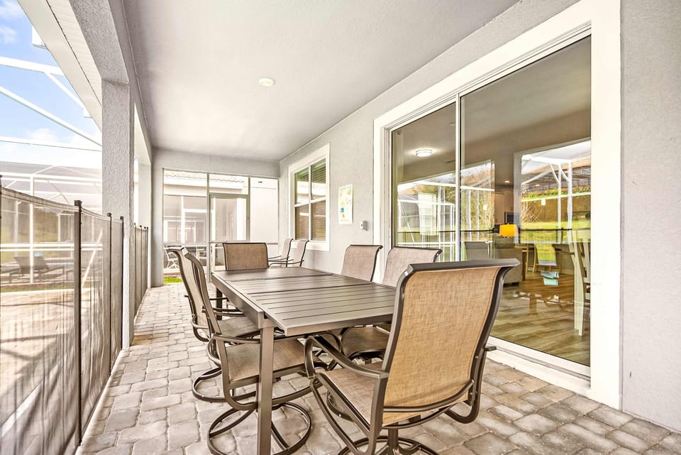 Relax and dine on this spacious patio, ideal for family gatherings and enjoying the serene surroundings.