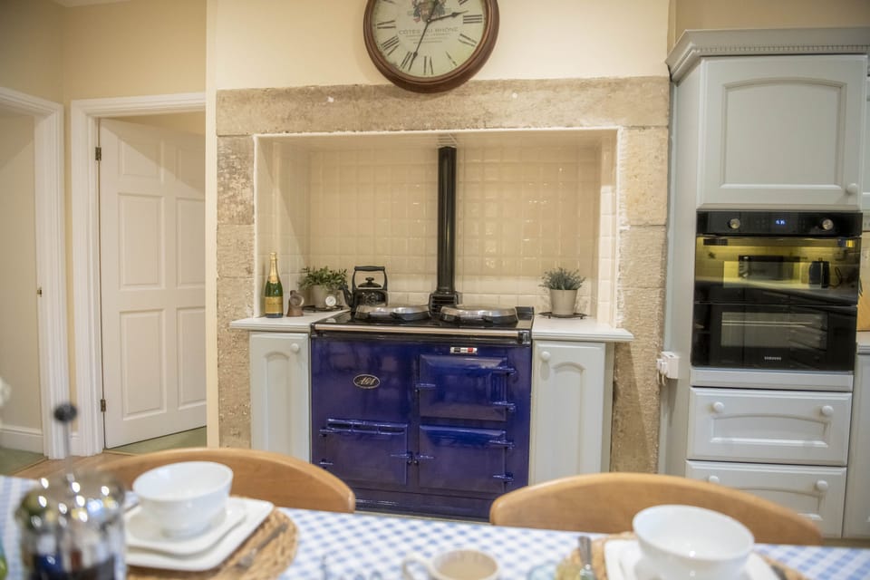 The kitchen boasts a two oven oil fired Aga