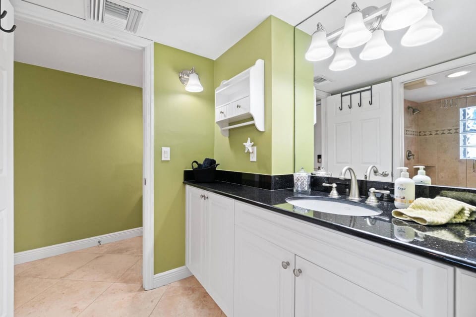 The bathroom also has access from the main entry hallway.