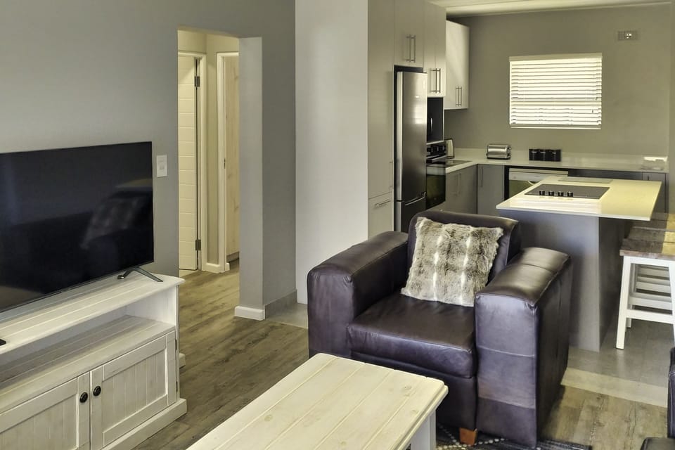 Family Apartment | Living area | 53-inch flat-screen TV with cable channels