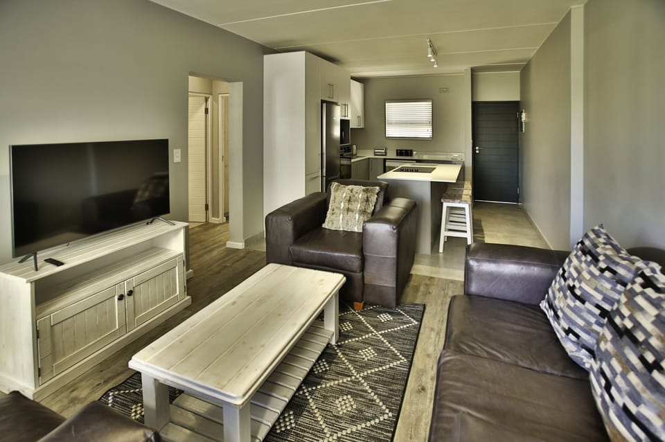 Family Apartment | Living area | 53-inch flat-screen TV with cable channels
